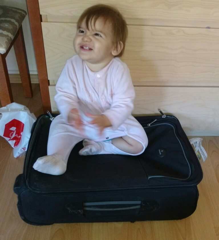Someone wants already to travel inside giagias luggage!